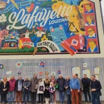 45 ans du jumelage: la Maire de Lafayette aux côtés des membres du Comité Namur-Lafayette devant la fresque Namur-Lafayette